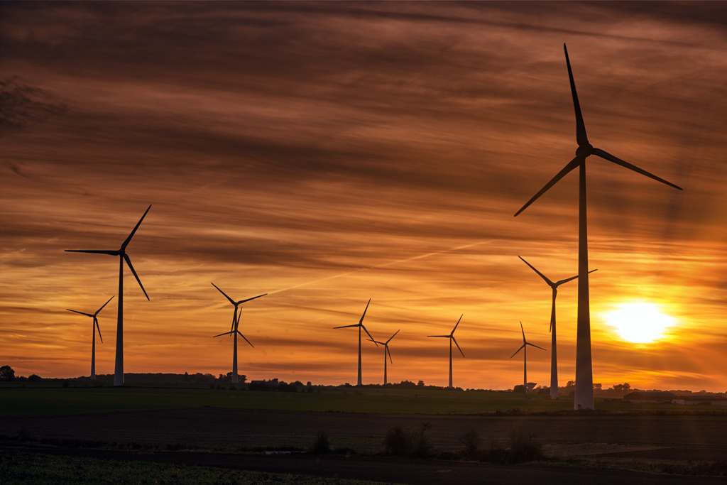 silhouette-windmills-field-during-sunset